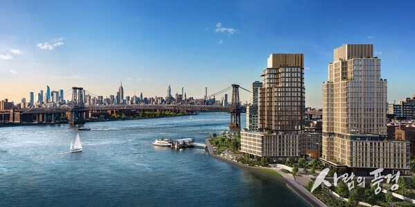 One Williamsburg Wharf rises along Brooklyn